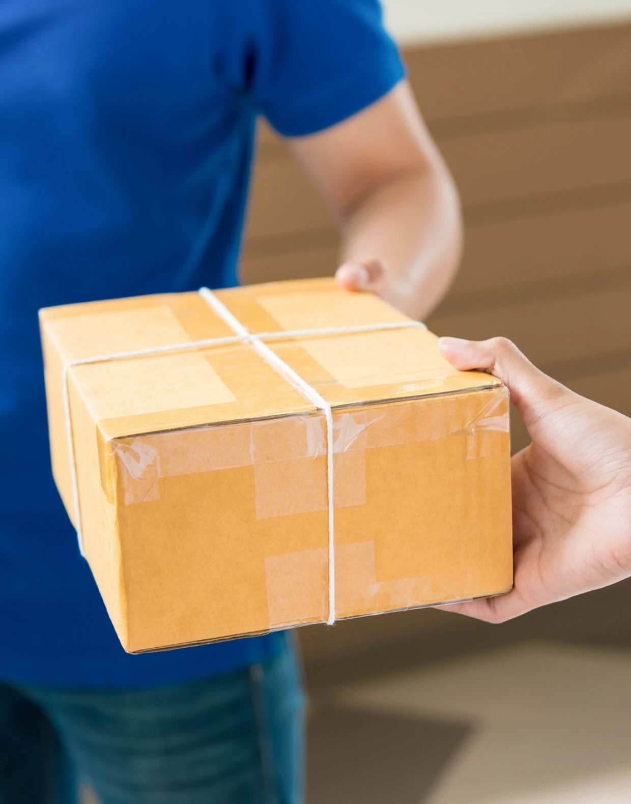 Delivery person giving a parcel