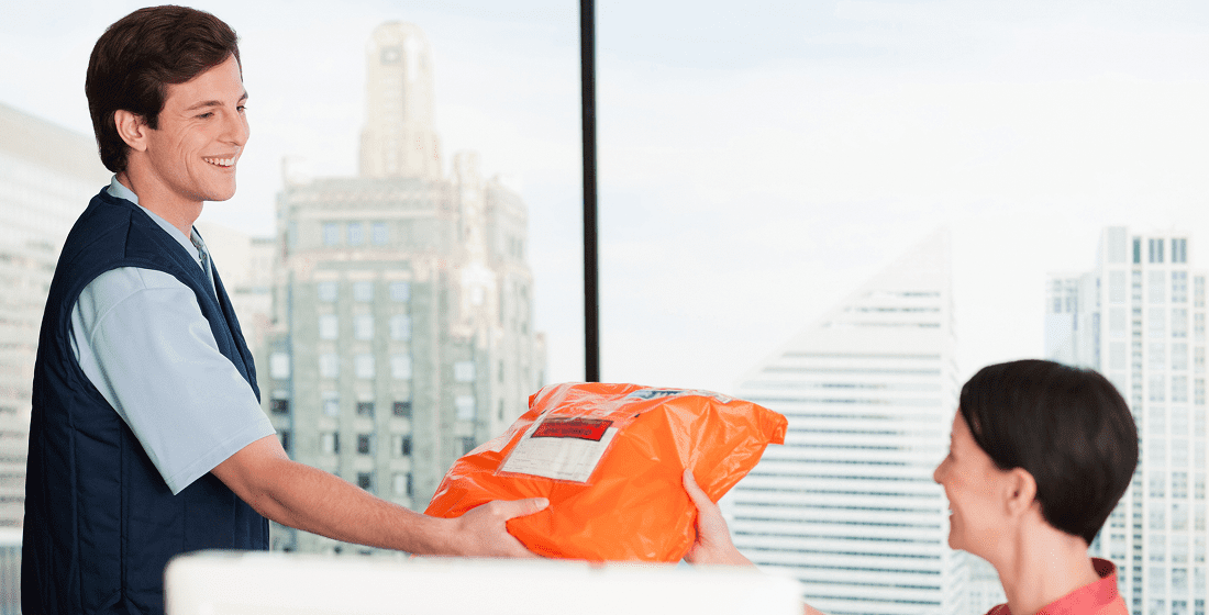 Office worker receives a delivery package