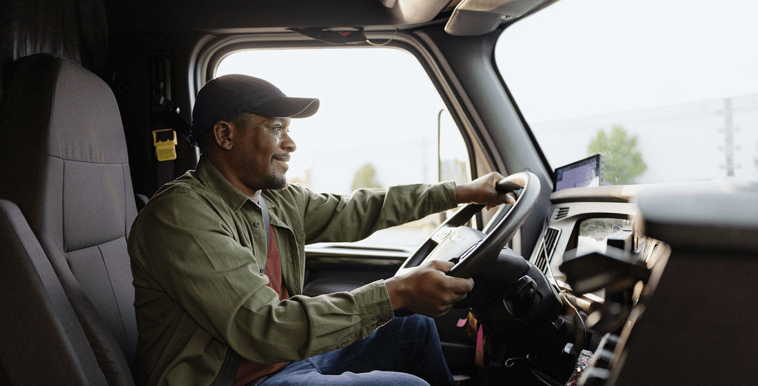 Man driving a large vehicle